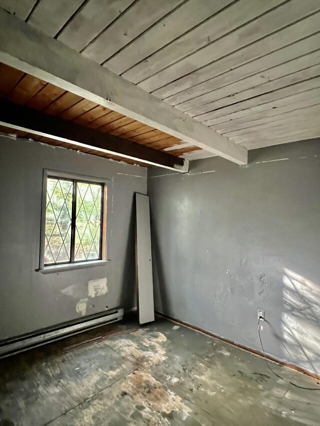 basement with a baseboard heating unit and wooden ceiling