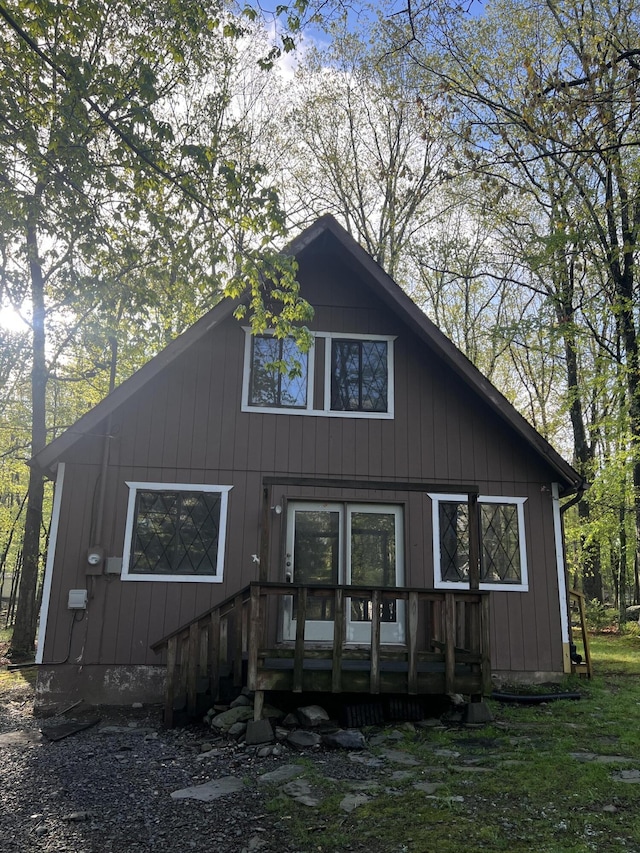 back of house featuring a deck