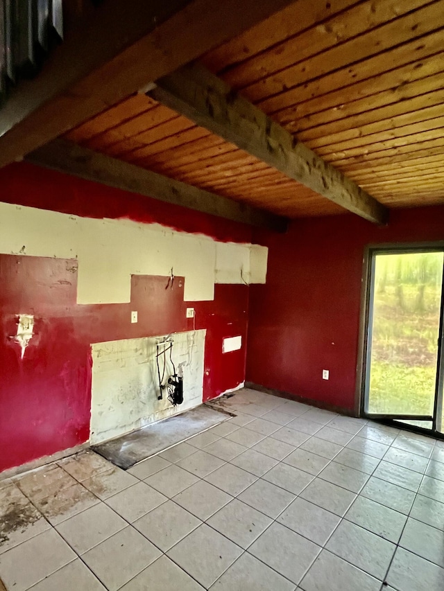 unfurnished room with light tile patterned floors, wooden ceiling, and beam ceiling