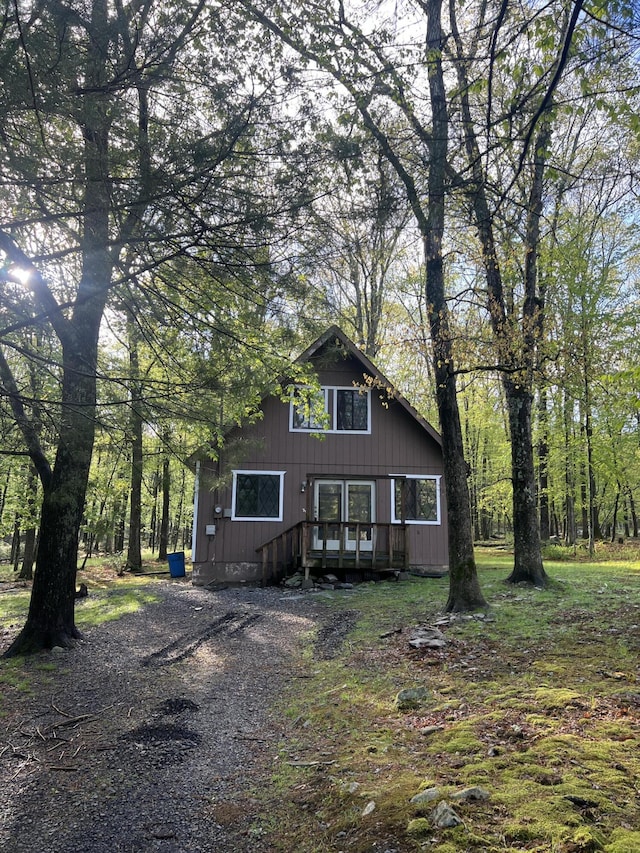chalet / cabin featuring a deck