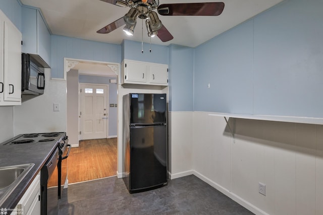 kitchen with black appliances, ceiling fan, white cabinets, and a sink