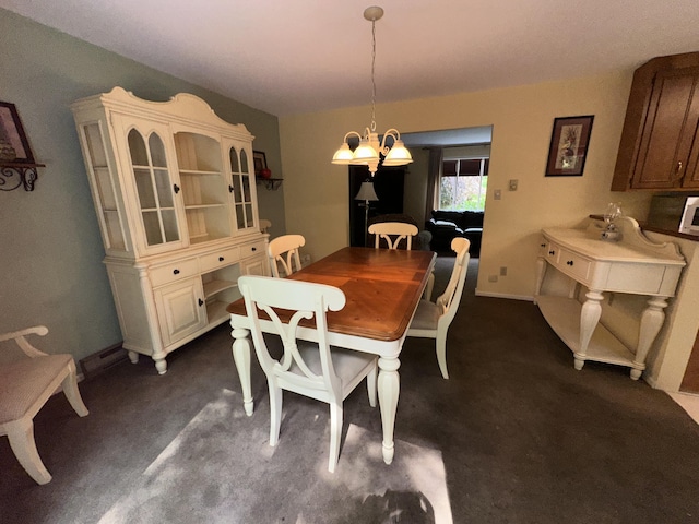 110 Alwen Ave, East Stroudsburg, PA 18301 - dining area featuring dark carpet and a chandelier