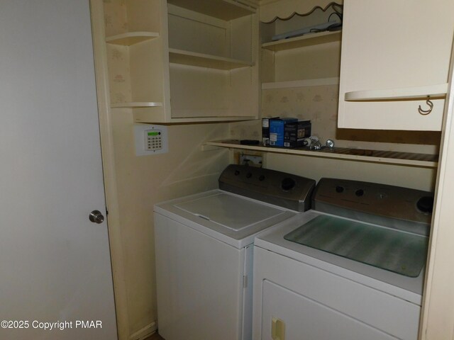 clothes washing area with laundry area and washer and dryer