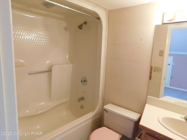 bathroom with toilet, shower / tub combination, and vanity