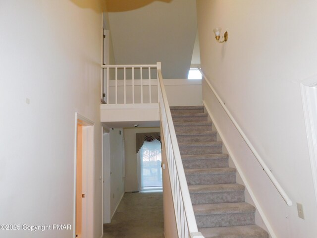 stairs with a towering ceiling