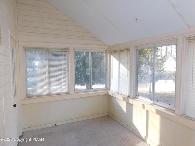 unfurnished sunroom with vaulted ceiling