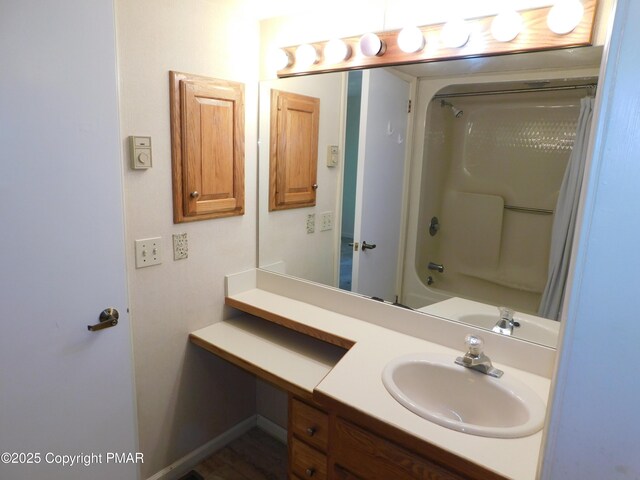 bathroom featuring shower / bath combination with curtain and vanity