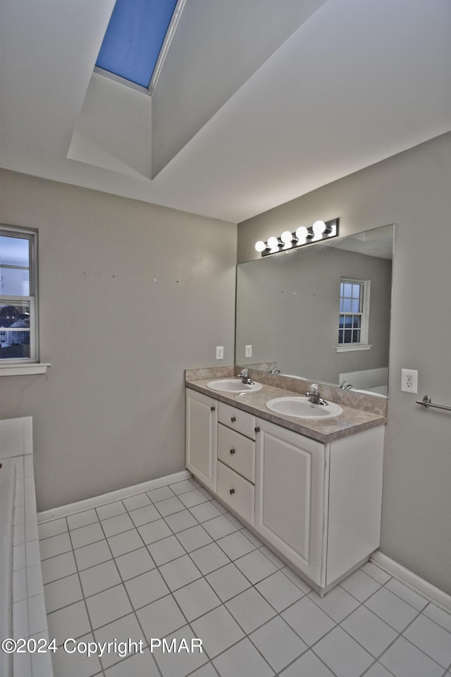 127 Bethpage Ter, Easton, PA 18042 - full bathroom featuring double vanity, tile patterned flooring, and a skylight