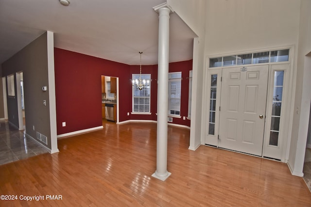 127 Bethpage Ter, Easton, PA 18042 - foyer with decorative columns, a chandelier, and wood finished floors