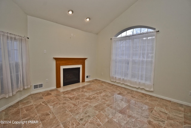 127 Bethpage Ter, Easton, PA 18042 - unfurnished living room with high vaulted ceiling and a fireplace