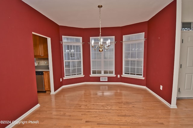 127 Bethpage Ter, Easton, PA 18042 - unfurnished dining area featuring light wood-type flooring and a chandelier