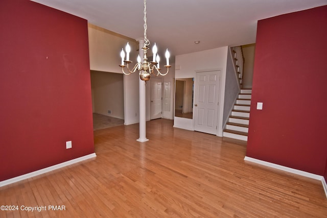 127 Bethpage Ter, Easton, PA 18042 - unfurnished dining area with stairway, light wood finished floors, and a chandelier