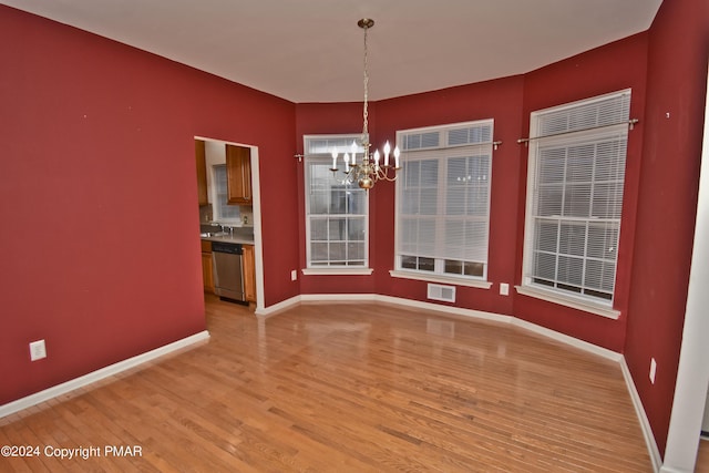 127 Bethpage Ter, Easton, PA 18042 - unfurnished dining area featuring a chandelier and light wood finished floors
