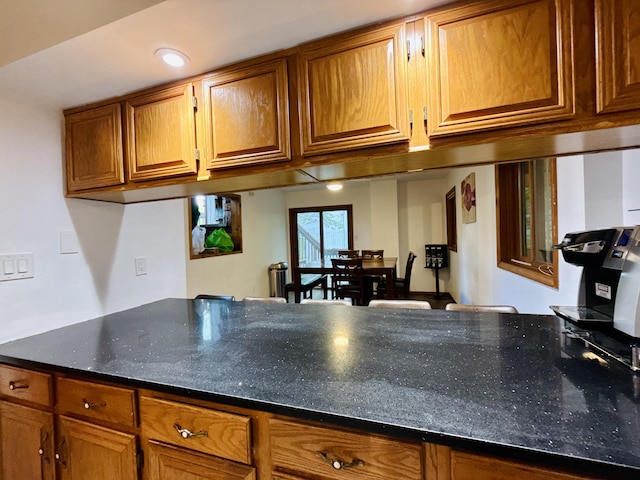 119 Sterling Cir, Bushkill, PA 18324 - kitchen with brown cabinetry and dark stone countertops