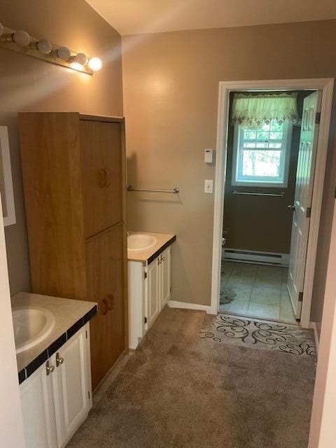 3124 Bluebird Dr, Bushkill, PA 18324 - bathroom featuring vanity and a baseboard heating unit