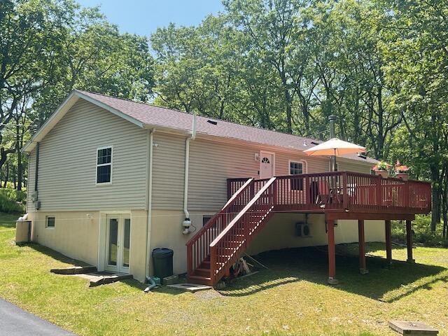 3124 Bluebird Dr, Bushkill, PA 18324 - rear view of property with a wooden deck, a yard, stairway, and french doors