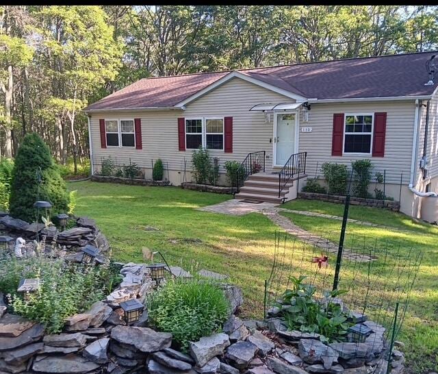 3124 Bluebird Dr, Bushkill, PA 18324 - ranch-style house with a front yard and a shingled roof
