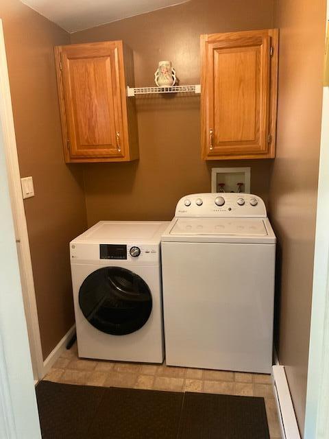 3124 Bluebird Dr, Bushkill, PA 18324 - laundry room featuring independent washer and dryer, baseboard heating, and cabinet space