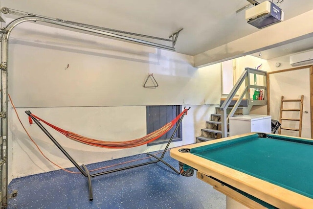 348 Fernwood Dr, East Stroudsburg, PA 18301 - recreation room with an AC wall unit, speckled floor, and a garage