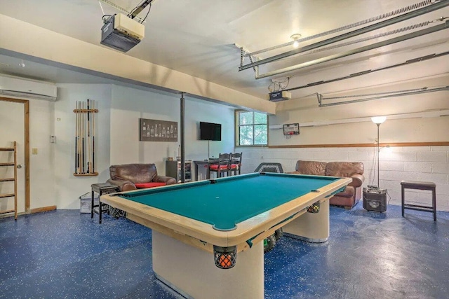 348 Fernwood Dr, East Stroudsburg, PA 18301 - game room featuring a wall unit AC, pool table, concrete block wall, concrete flooring, and a garage