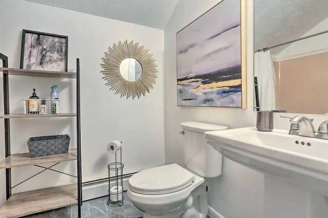 348 Fernwood Dr, East Stroudsburg, PA 18301 - full bathroom featuring a baseboard radiator, a textured ceiling, marble finish flooring, and curtained shower