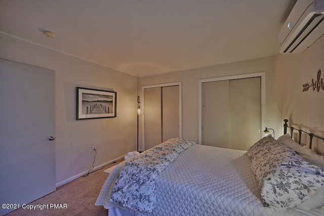 36 Maplewood Rd, Lake Harmony, PA 18624 - bedroom with a wall mounted AC, two closets, carpet floors, and baseboards