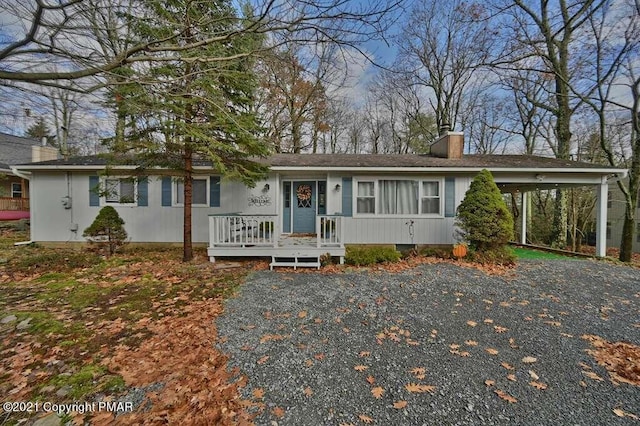 36 Maplewood Rd, Lake Harmony, PA 18624 - ranch-style house featuring a chimney and a carport