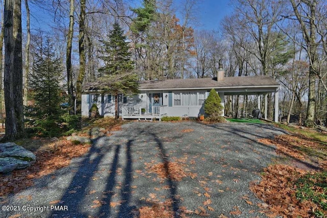 36 Maplewood Rd, Lake Harmony, PA 18624 - view of front of property featuring a chimney and asphalt driveway
