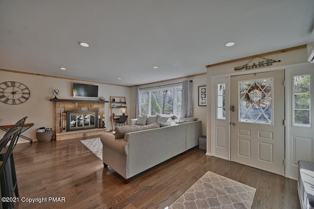 36 Maplewood Rd, Lake Harmony, PA 18624 - living area with crown molding, healthy amount of natural light, wood finished floors, a fireplace, and recessed lighting