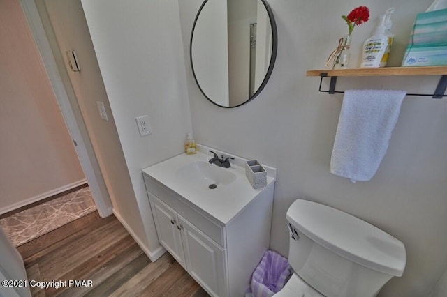 36 Maplewood Rd, Lake Harmony, PA 18624 - bathroom featuring vanity, wood finished floors, toilet, and baseboards