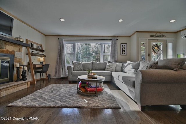 36 Maplewood Rd, Lake Harmony, PA 18624 - living area with crown molding, a fireplace, recessed lighting, wood finished floors, and a wall unit AC