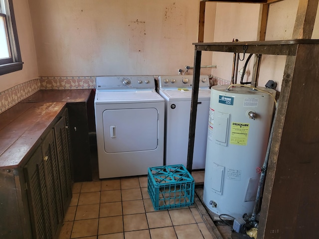 216 Buckhorn Ln, Cresco, PA 18326 - laundry room featuring electric water heater, cabinet space, light tile patterned floors, and separate washer and dryer