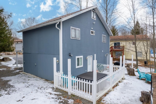 view of snow covered house