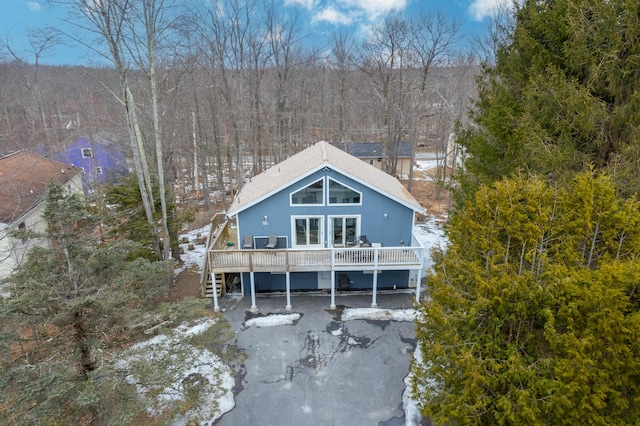 back of house with stairway and a wooden deck