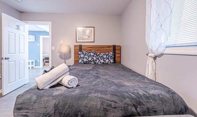 bedroom featuring wood finished floors