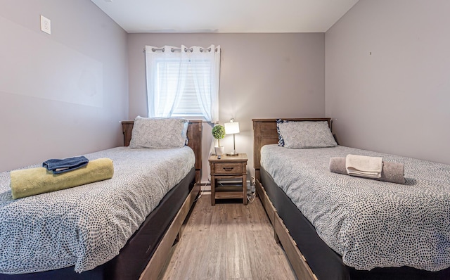 bedroom with light wood-type flooring