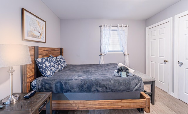 bedroom featuring wood finished floors