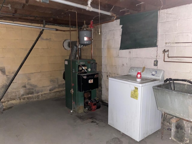 interior space featuring washer / clothes dryer, a heating unit, and a sink