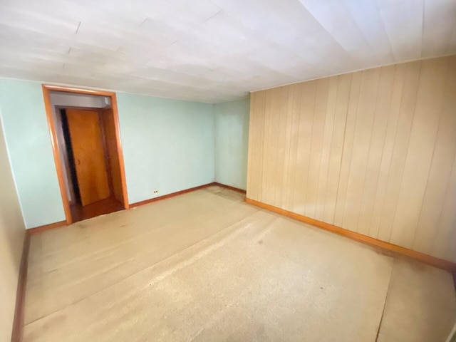 unfurnished room featuring baseboards