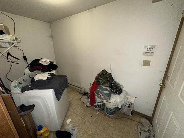 laundry room featuring tile patterned floors, laundry area, washer and dryer, and baseboards