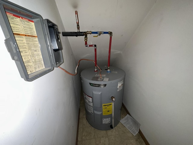 utility room featuring water heater