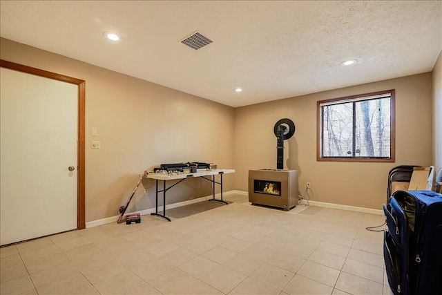 154 Elgin Way, Bushkill, PA 18324 - interior space featuring baseboards, a wood stove, recessed lighting, and visible vents