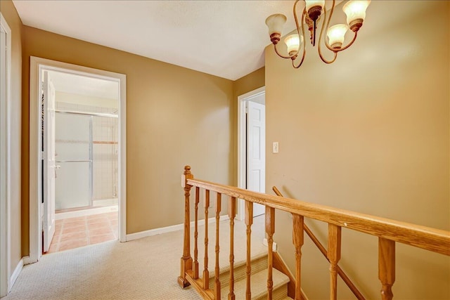 154 Elgin Way, Bushkill, PA 18324 - hall featuring light colored carpet, baseboards, a notable chandelier, and an upstairs landing
