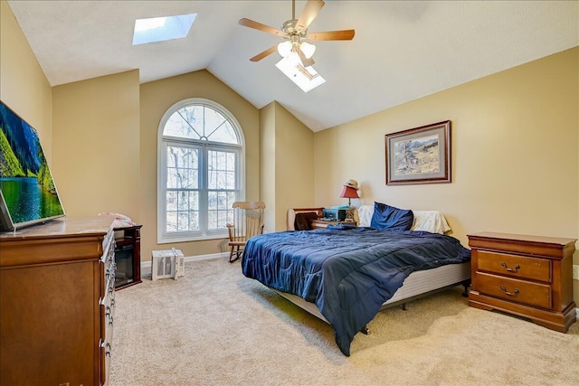 154 Elgin Way, Bushkill, PA 18324 - carpeted bedroom featuring vaulted ceiling with skylight, baseboards, and ceiling fan