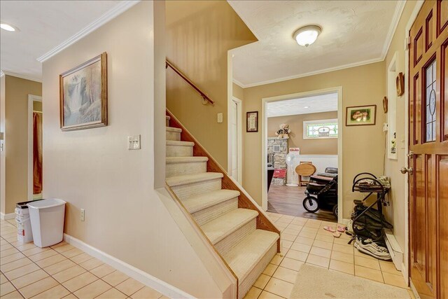 154 Elgin Way, Bushkill, PA 18324 - foyer entrance with ornamental molding, light tile patterned floors, and stairway