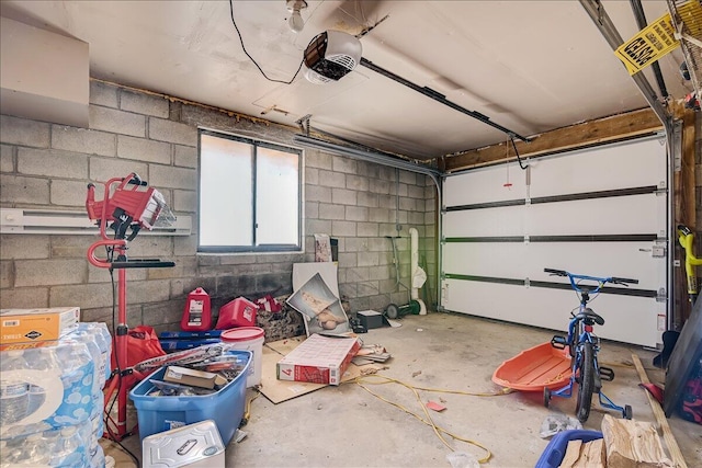 154 Elgin Way, Bushkill, PA 18324 - garage featuring a garage door opener and concrete block wall