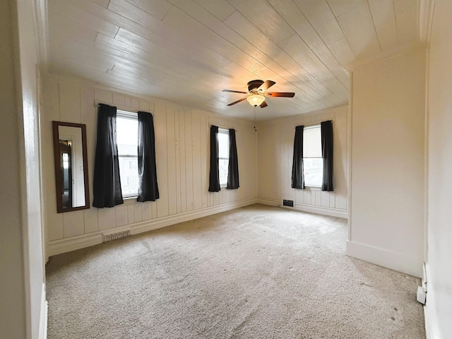 233 Lafayette Ave, Palmerton, PA 18071 - unfurnished room with light carpet, wooden ceiling, and a ceiling fan