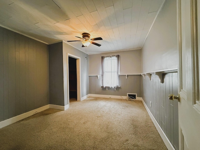233 Lafayette Ave, Palmerton, PA 18071 - unfurnished room featuring a ceiling fan, carpet flooring, wood ceiling, and wooden walls