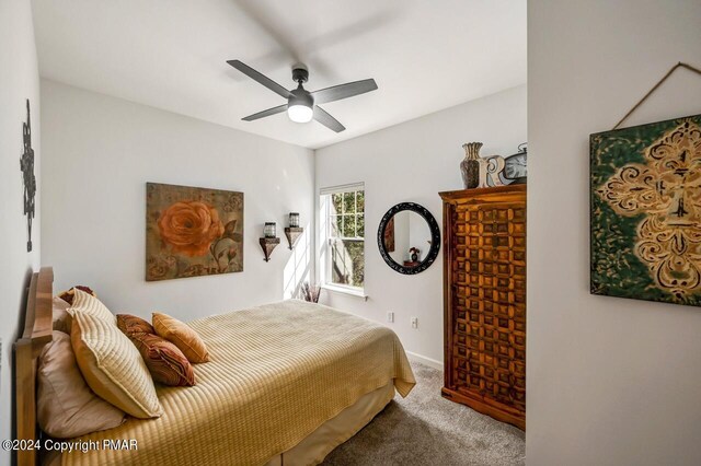 bedroom featuring carpet, ceiling fan, and baseboards