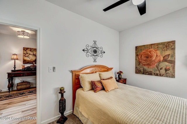 bedroom featuring ceiling fan and baseboards